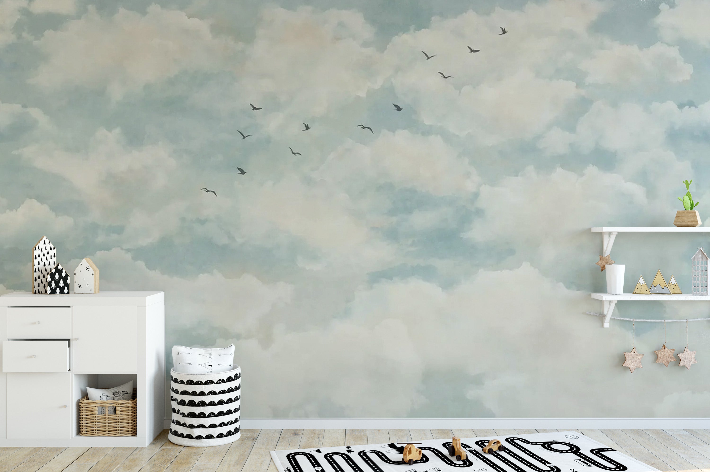 Artistic clouds and birds mural in soft watercolor tones
