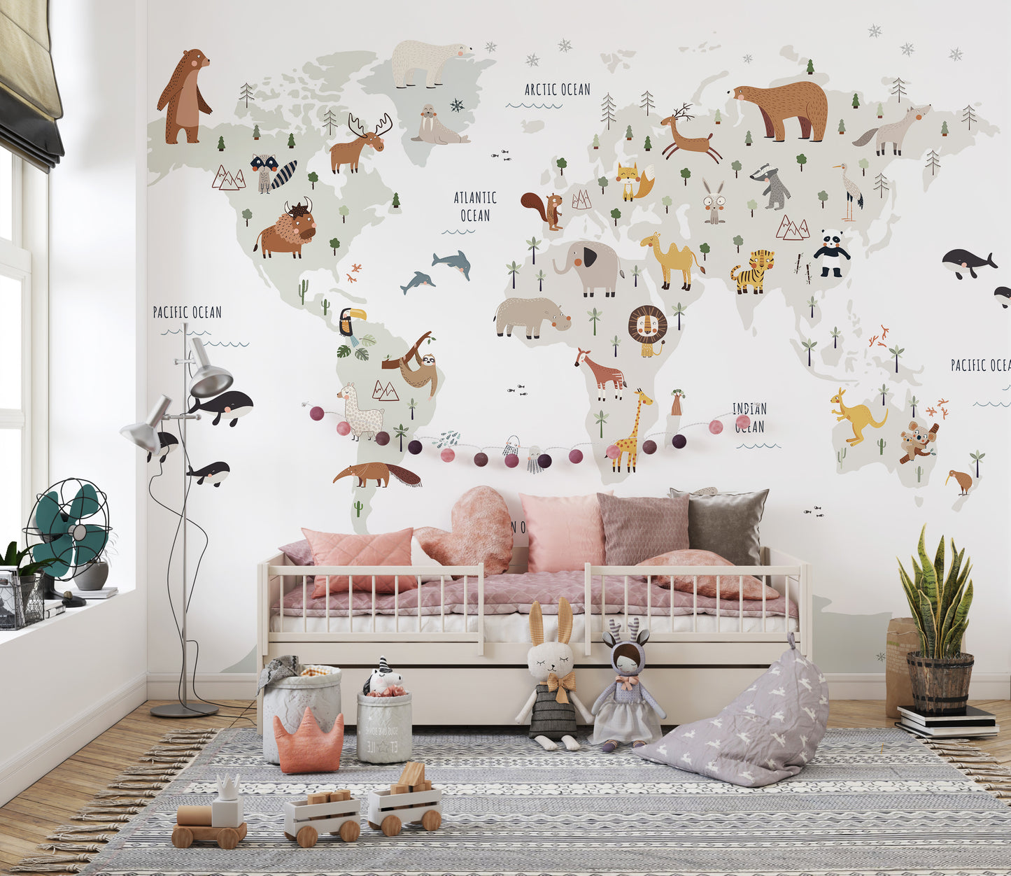 Kids' room mural with animals on a white world map
