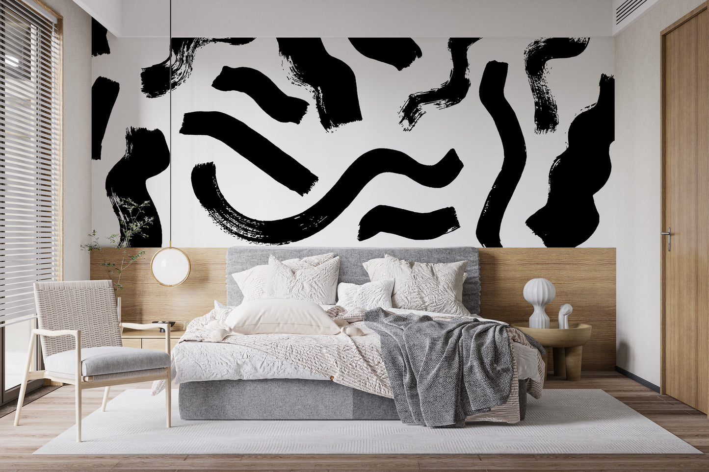 Bold and expressive black brushstrokes on a wall mural.
