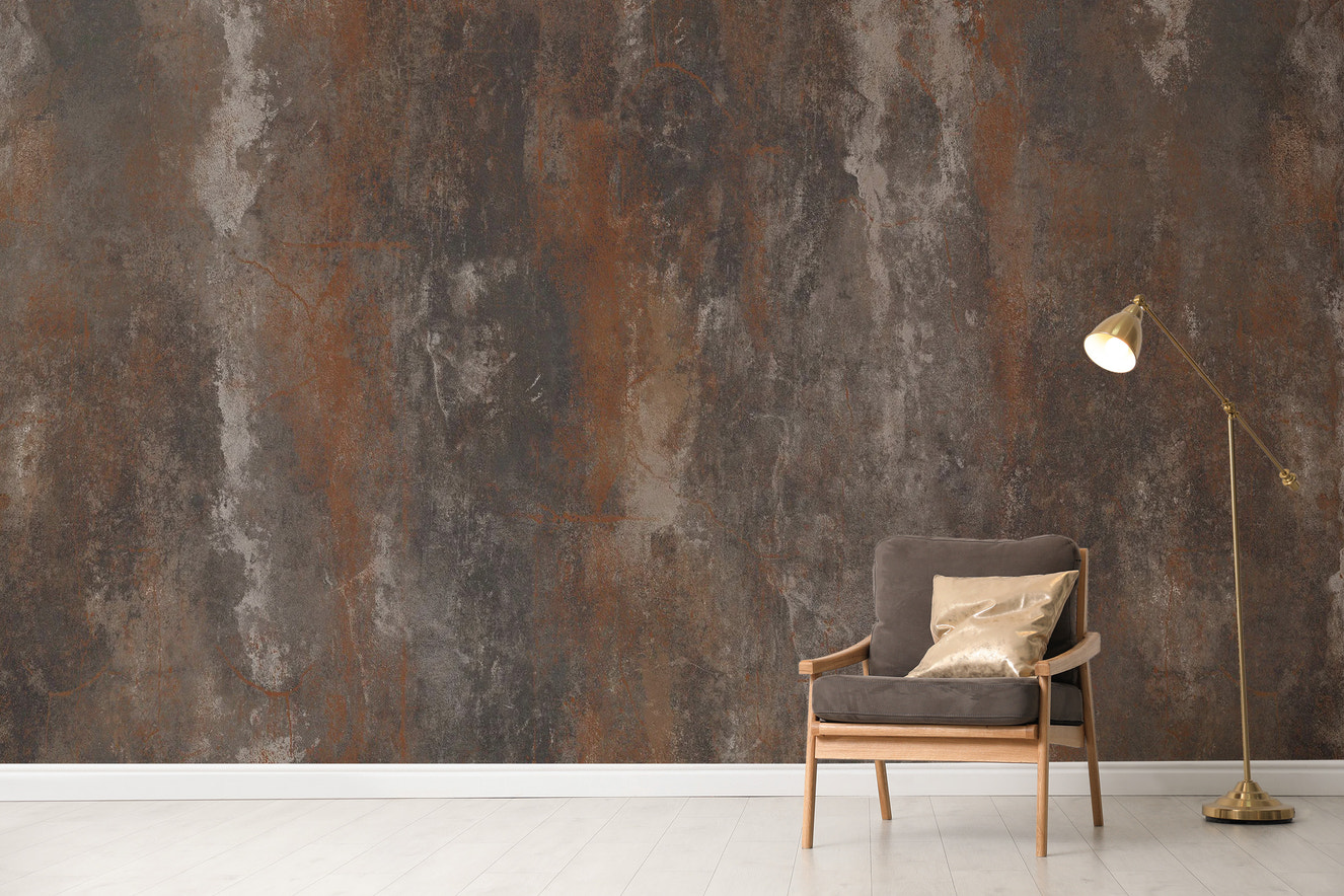 Textured brown metal wallpaper with a rustic finish.
