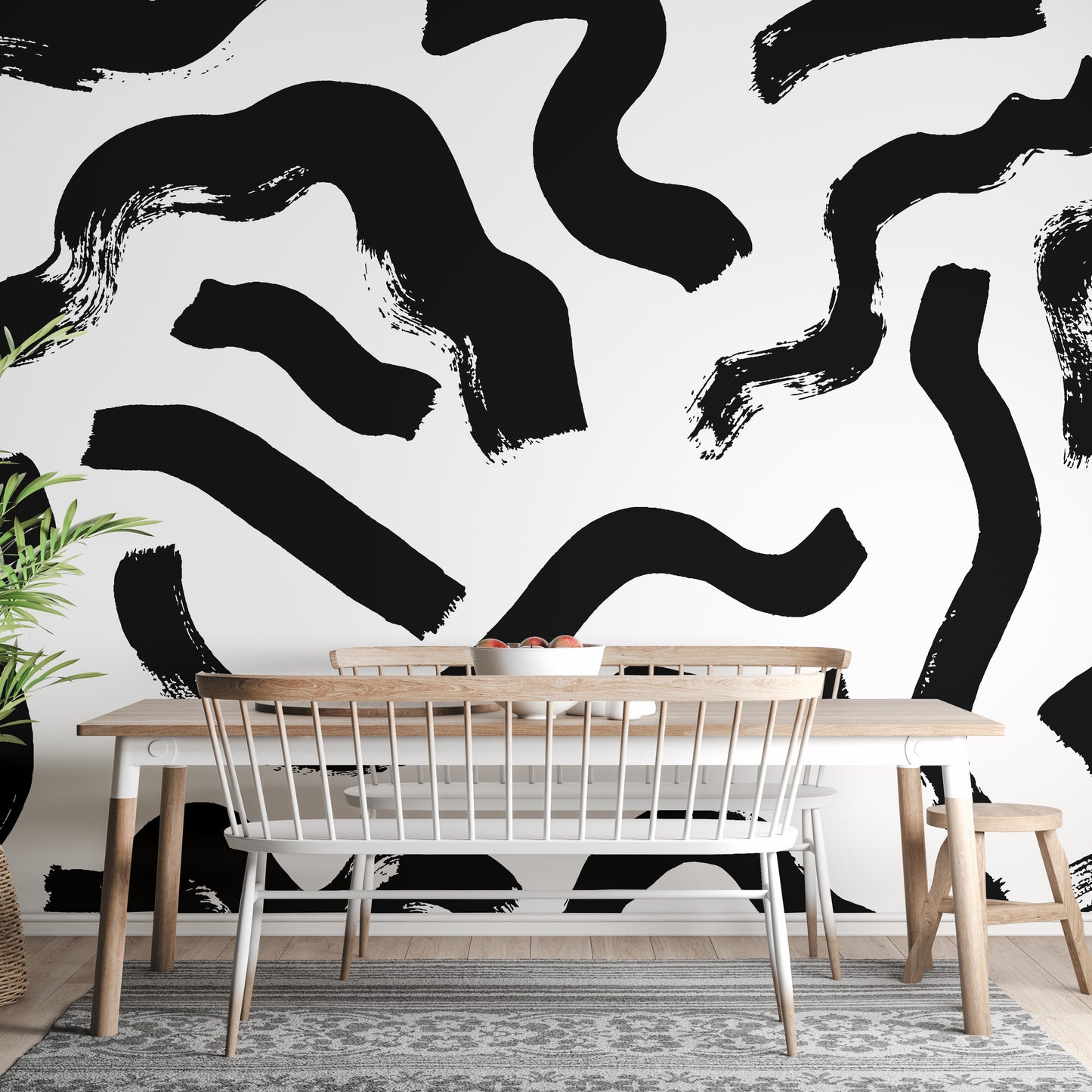 Artistic black brushstrokes mural for a modern vibe.
