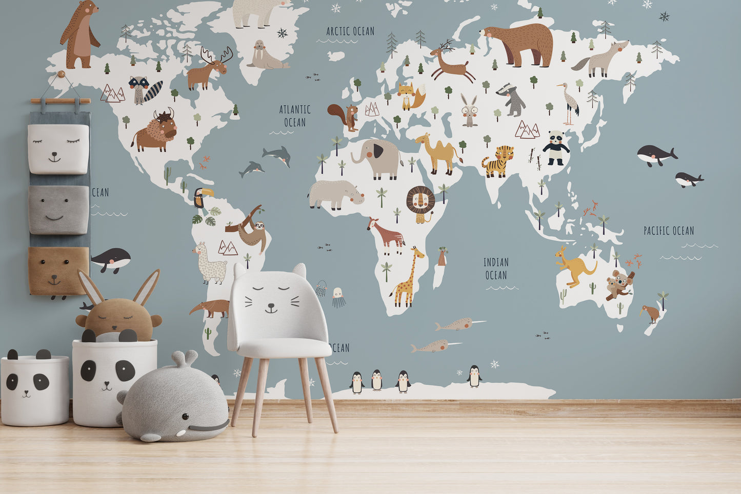 Blue-themed world map mural with wildlife illustrations
