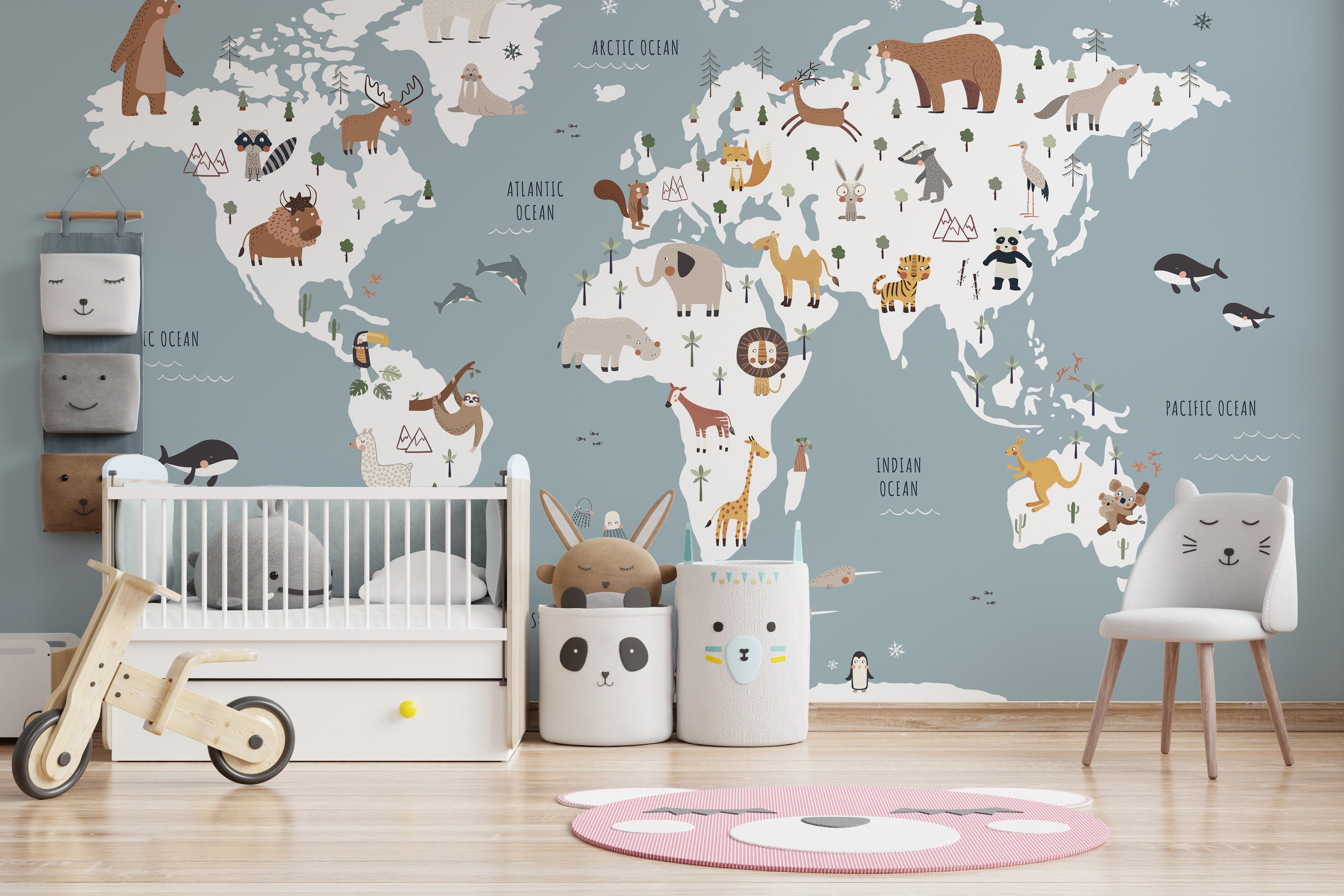 Blue-themed world map mural with wildlife illustrations
