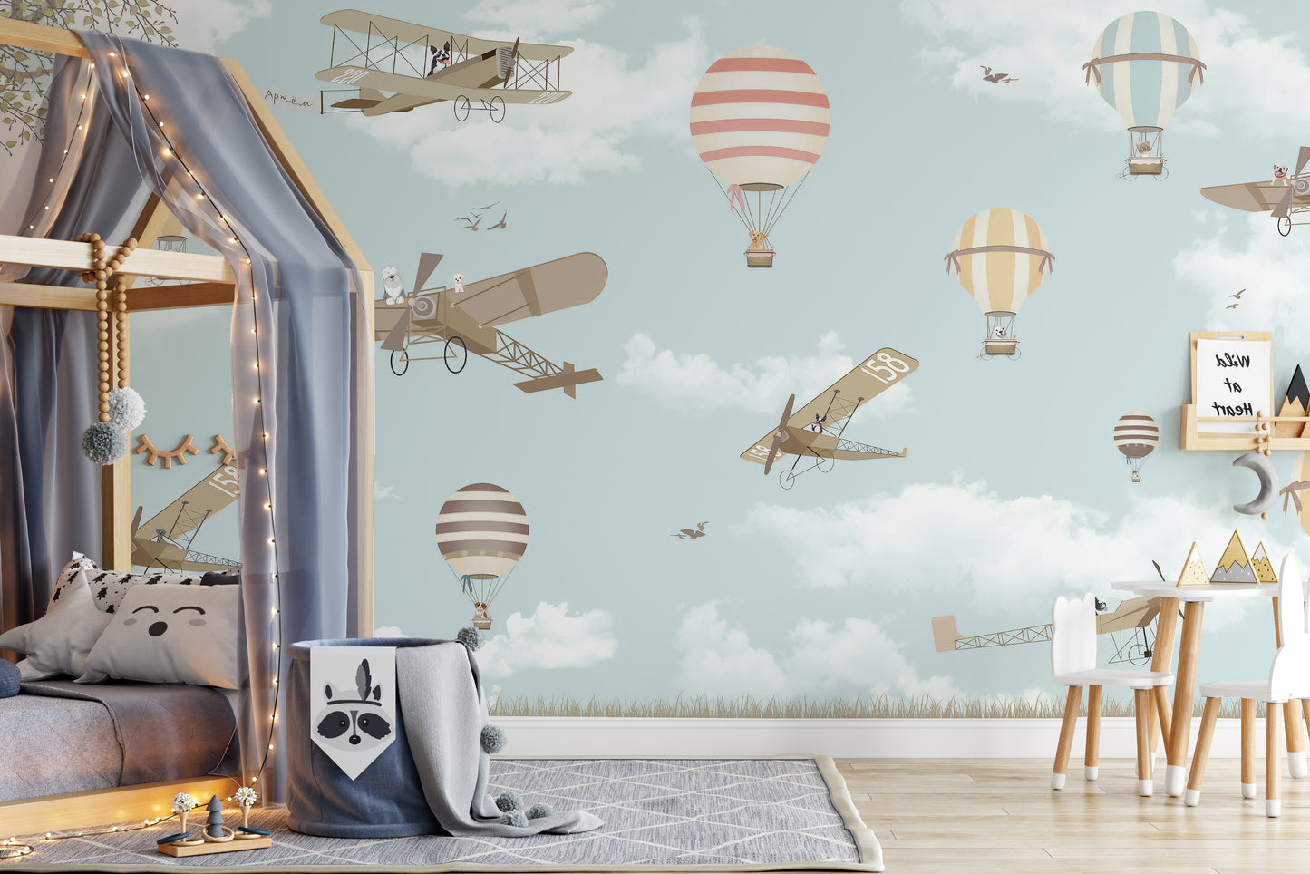 Whimsical hot air balloon mural with planes