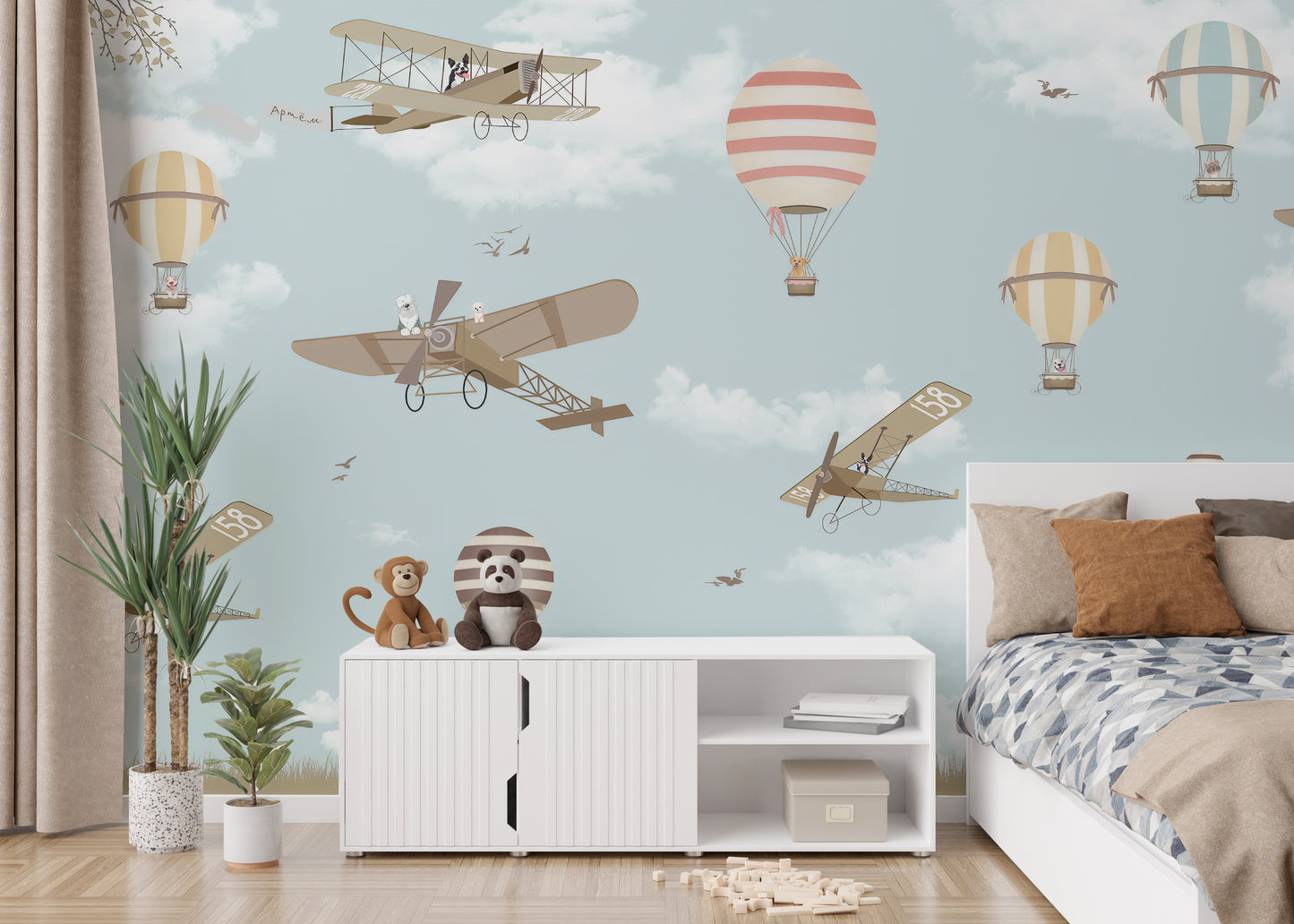 Sky-themed mural with planes and hot air balloons