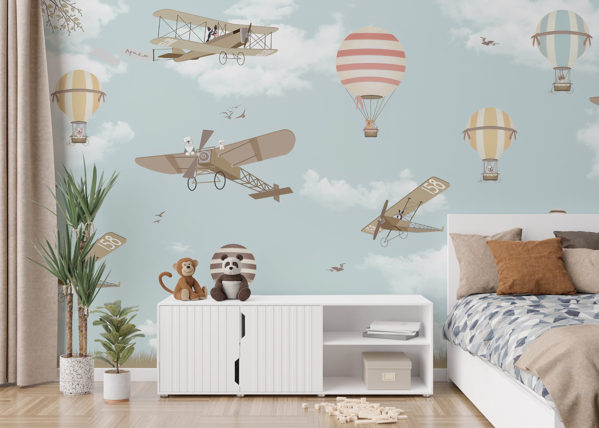 Sky-themed mural with planes and hot air balloons