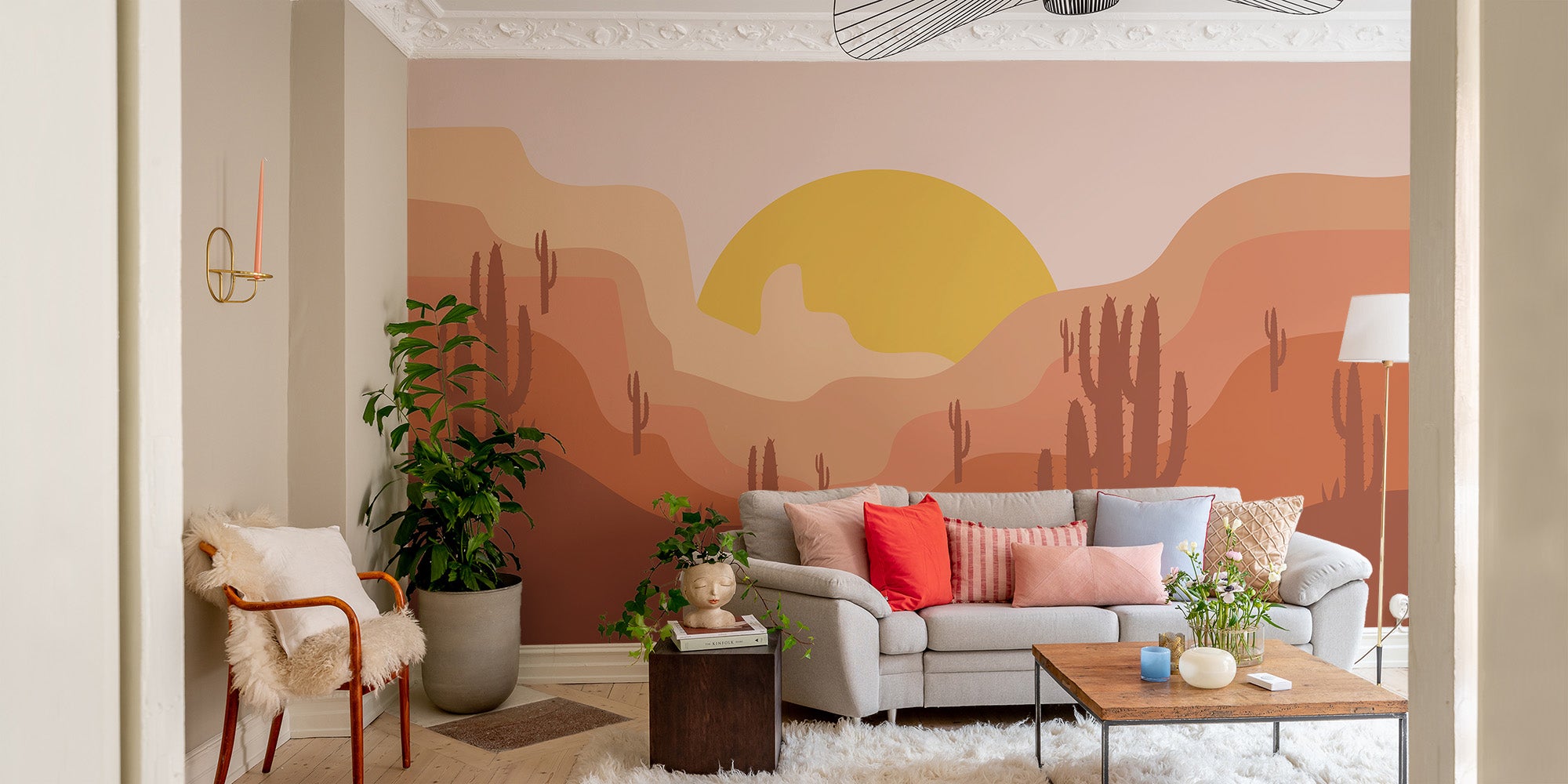 Golden sun sets over cactus landscape wall mural.