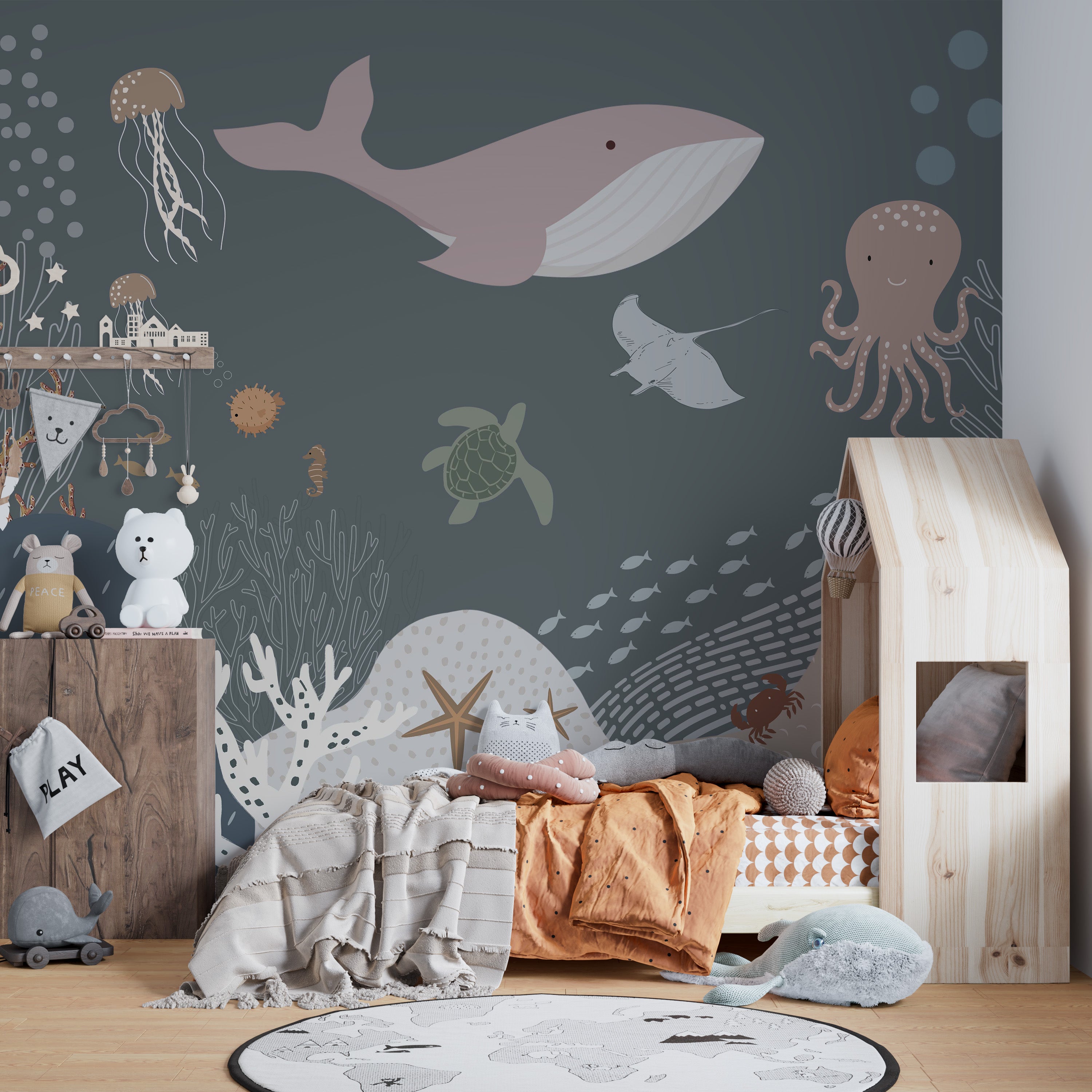 Cheerful jellyfish and starfish in an ocean mural.
