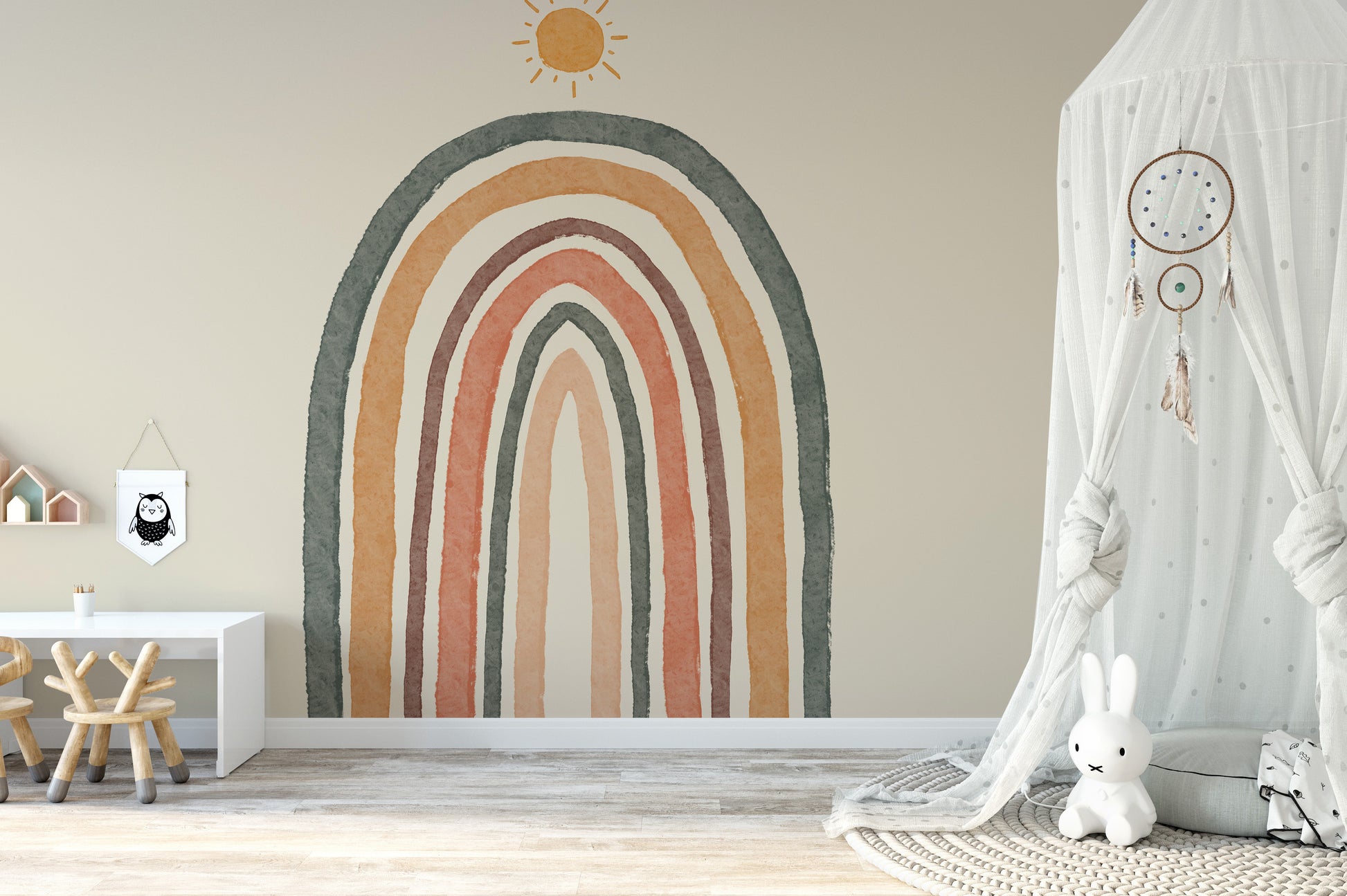 Boho-style nursery mural with soft rainbow tones and patterns.
