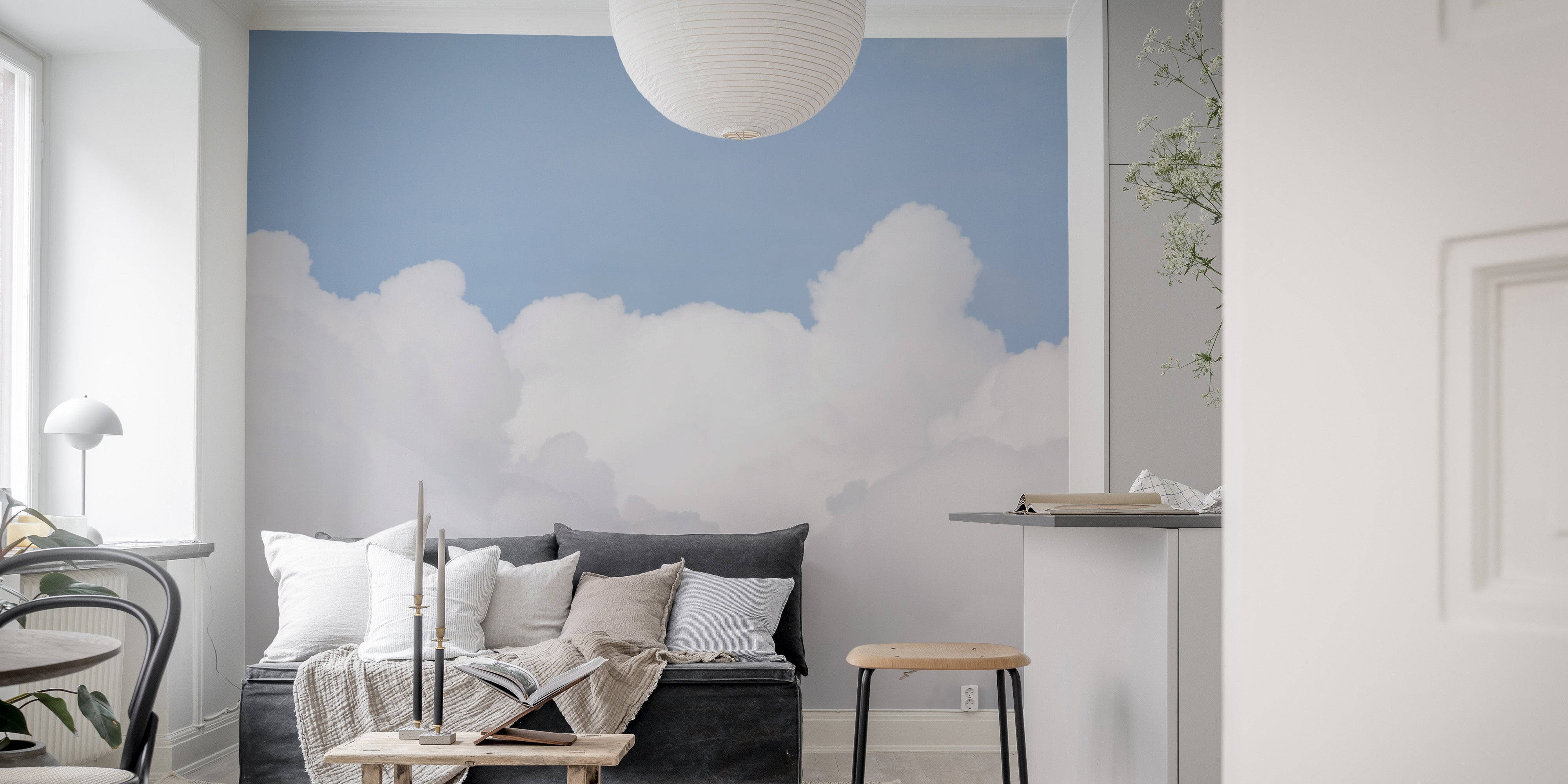 Azure sky wallpaper mural featuring delicate white clouds.
