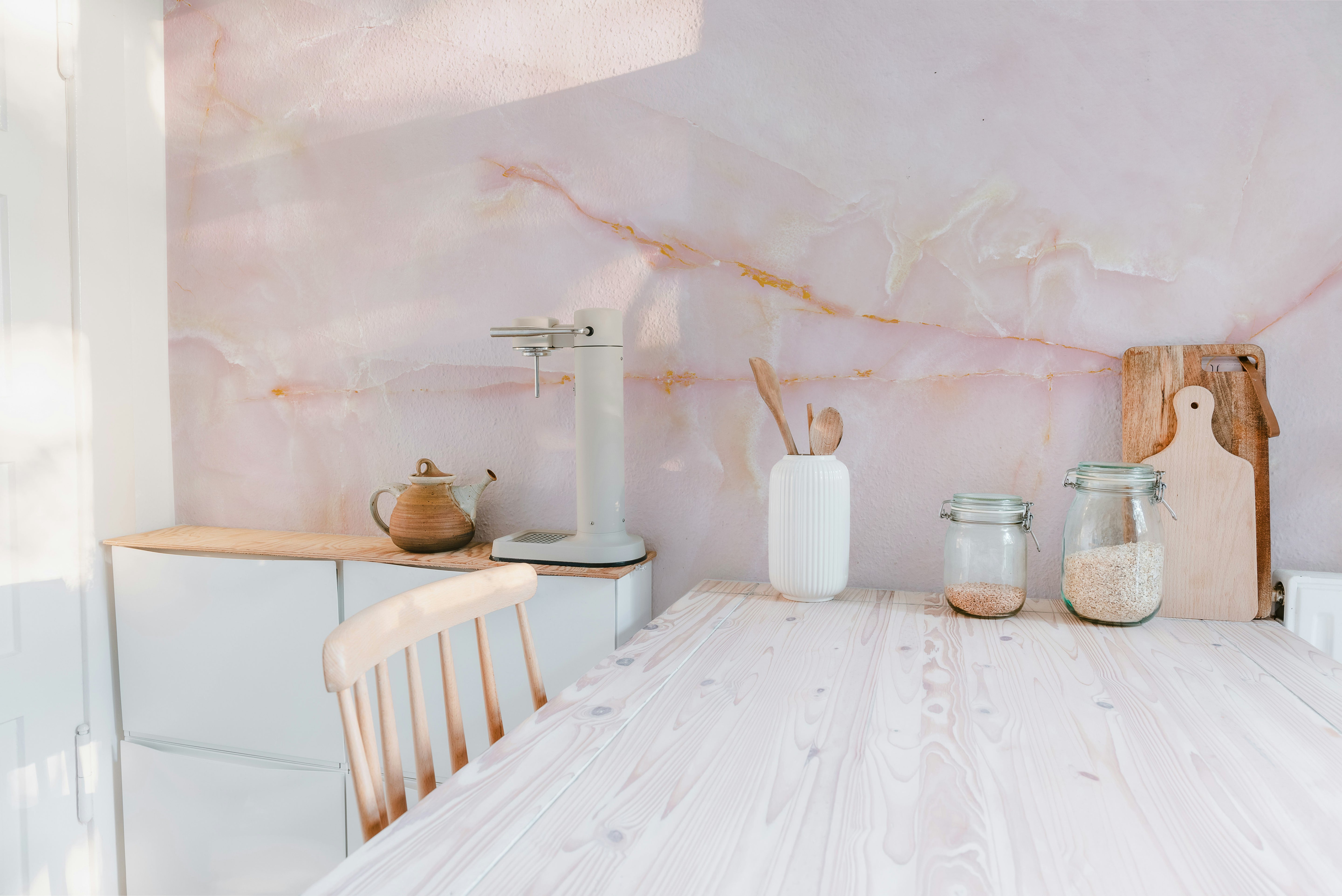 Pink onyx marble wallpaper mural with intricate and soft designs.