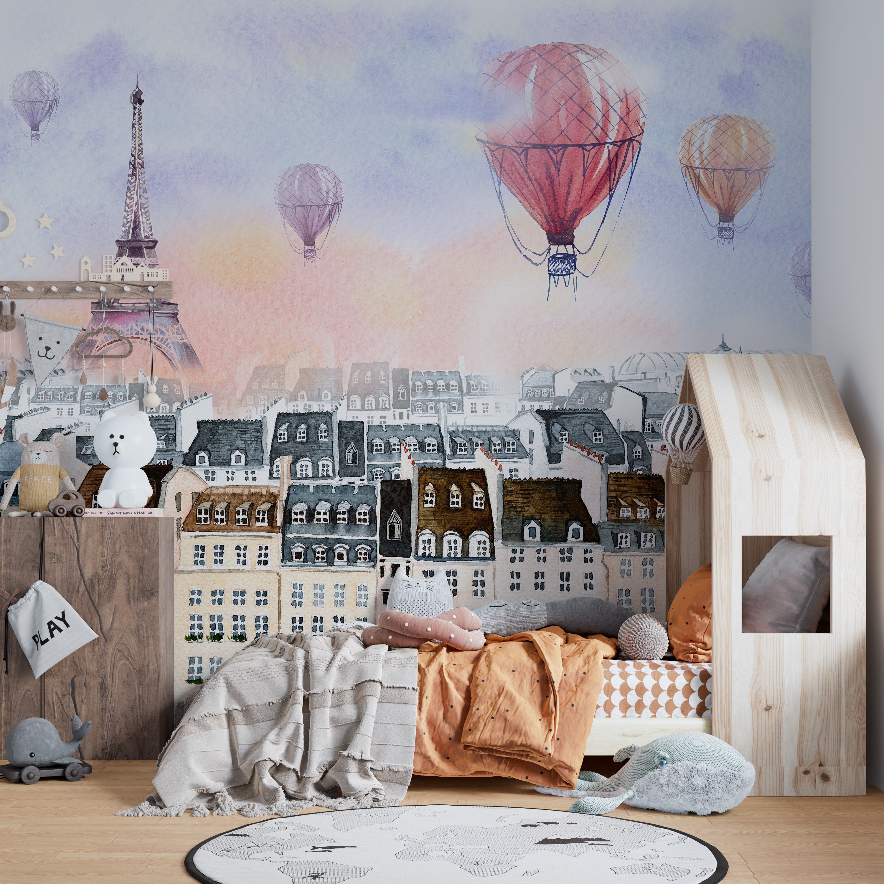 Watercolor mural featuring a hot air balloon over Paris cityscape.
