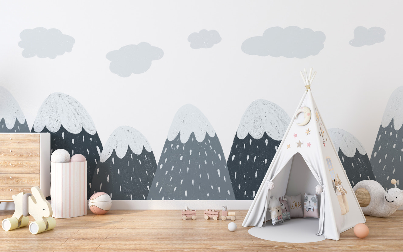 Snow-capped mountains mural for a cozy kids' room decor.
