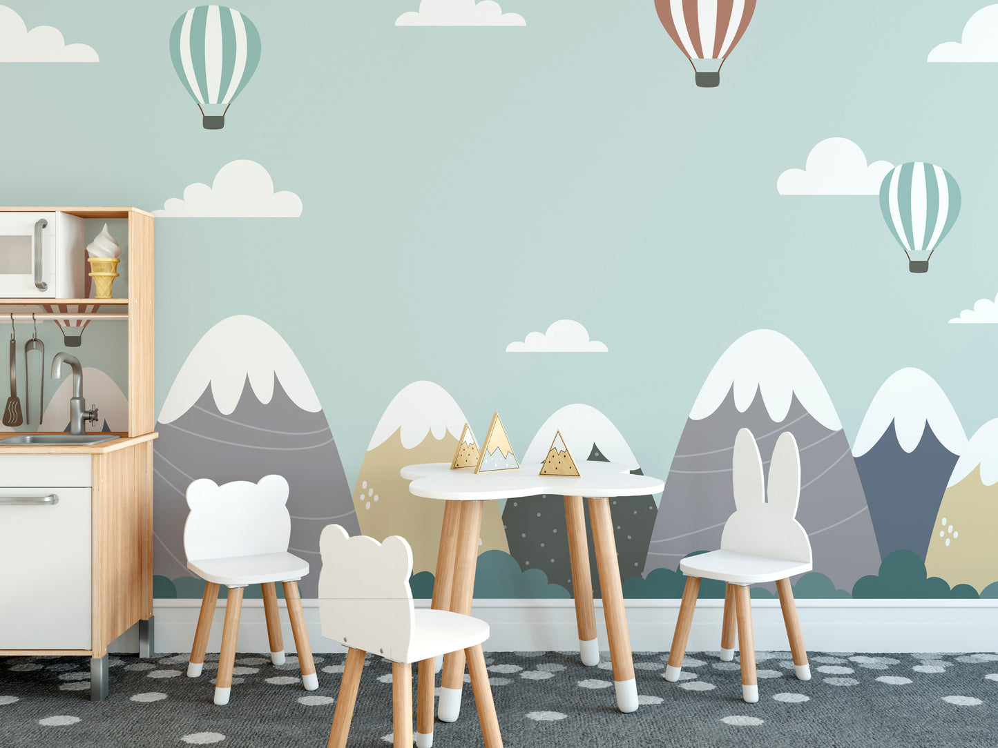 Dreamy mural of hot air balloons above mountains and clouds.
