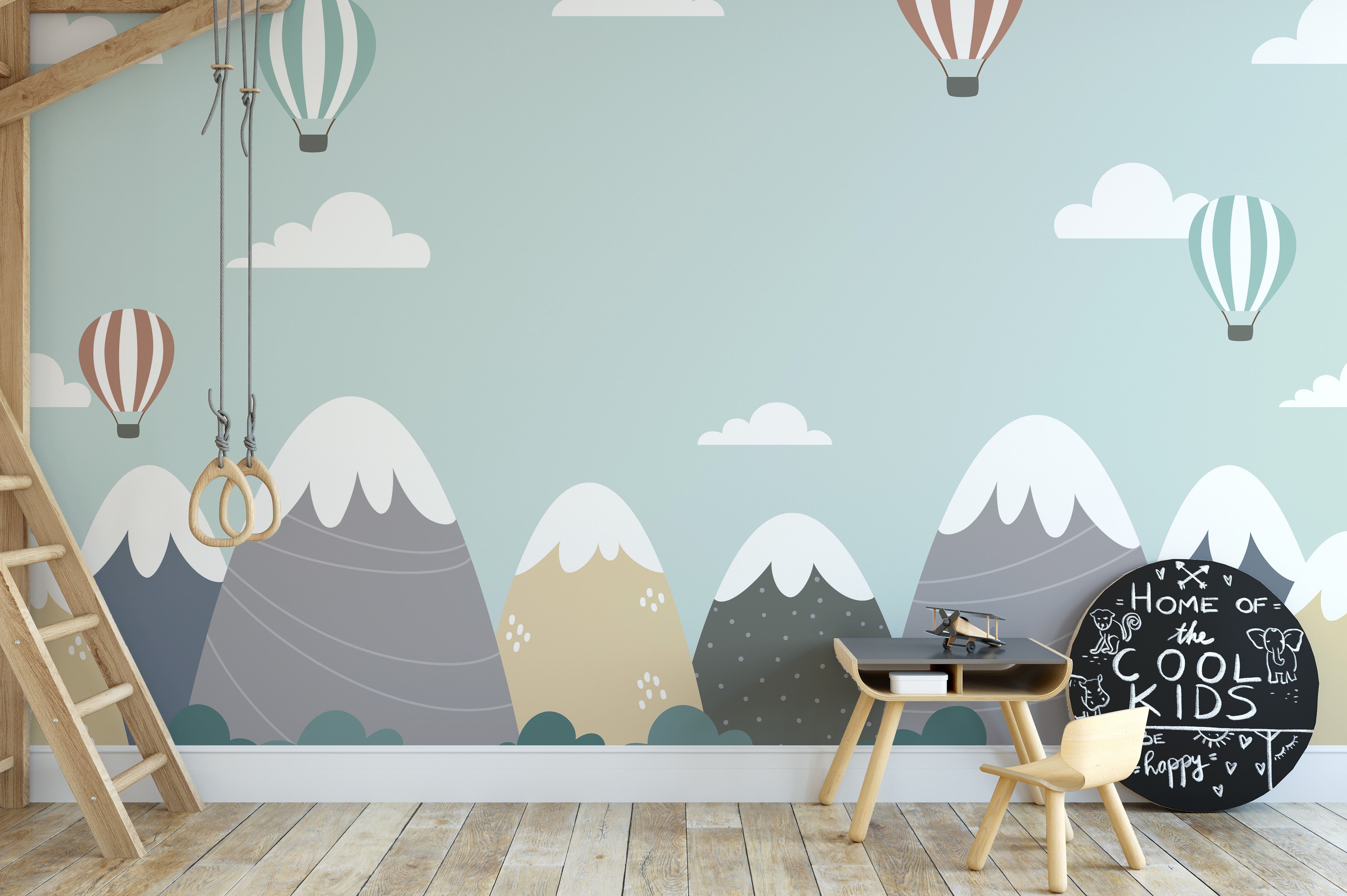 Hot air balloon mural with mountain views and cloud backdrops.
