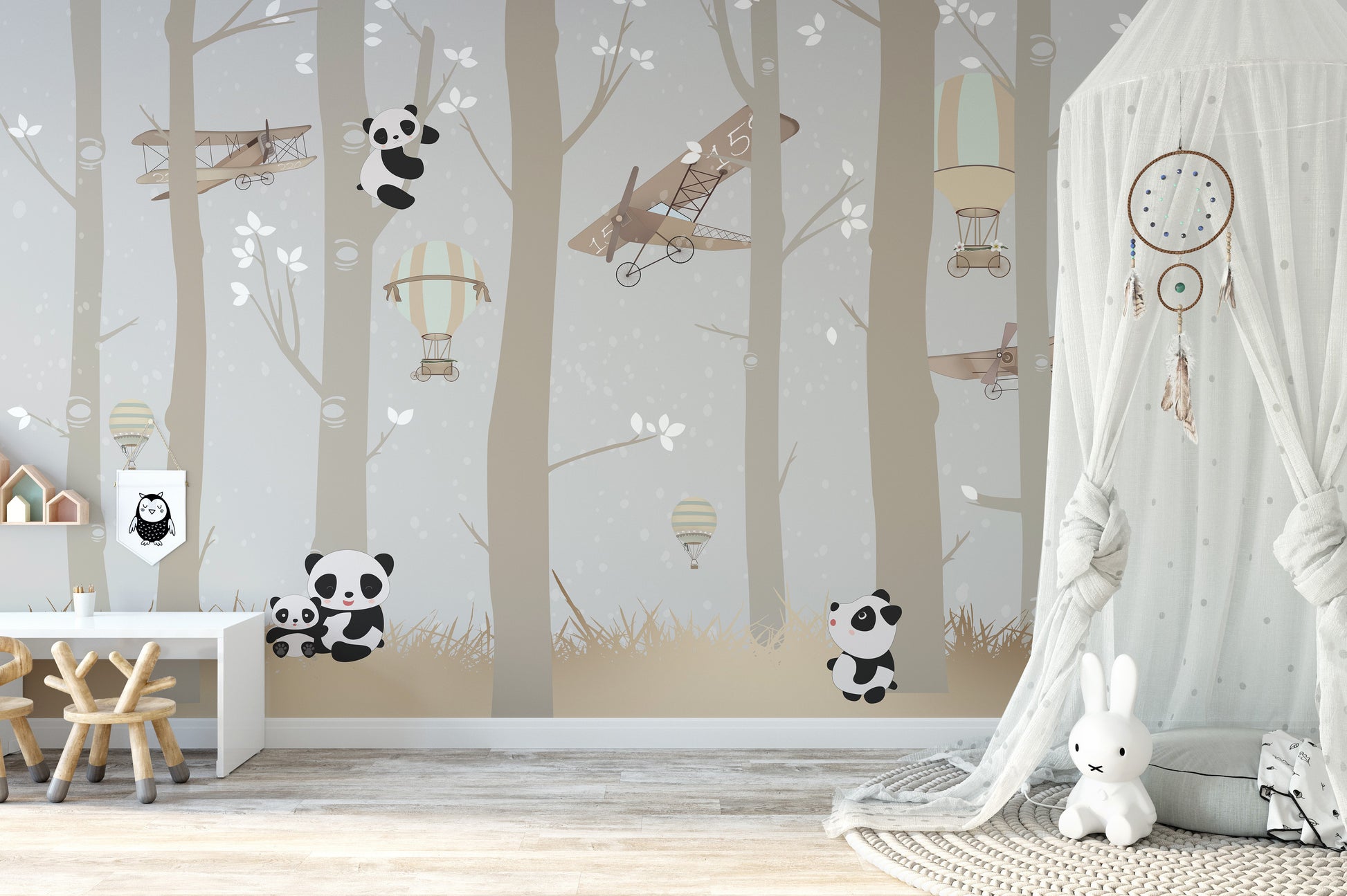 Airborne pandas mural with lush forest charm for kids' rooms.
