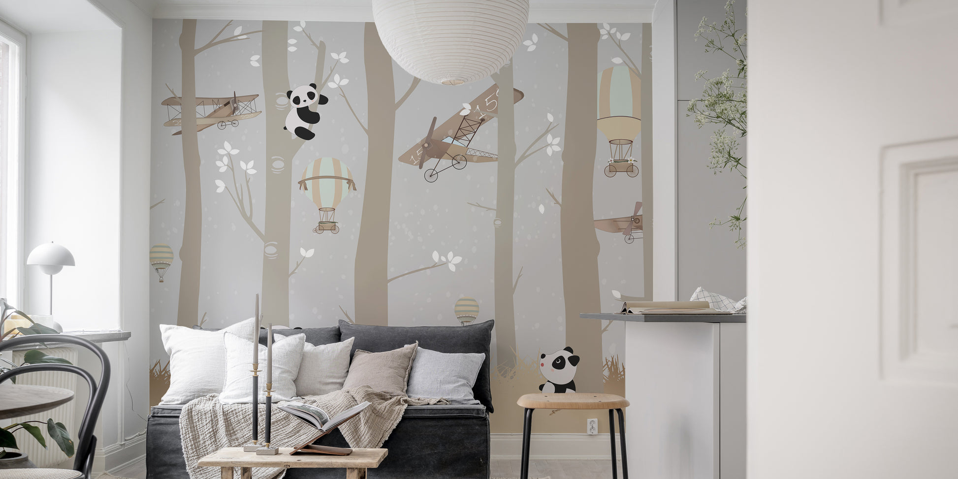 Forest delight mural showcasing playful airborne pandas.
