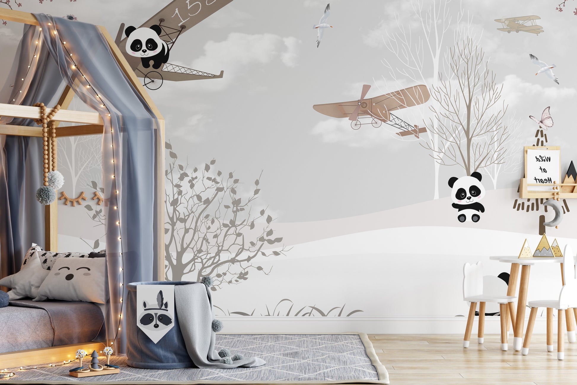 Panda with wings mural in a snowy wonderland for playful decor.
