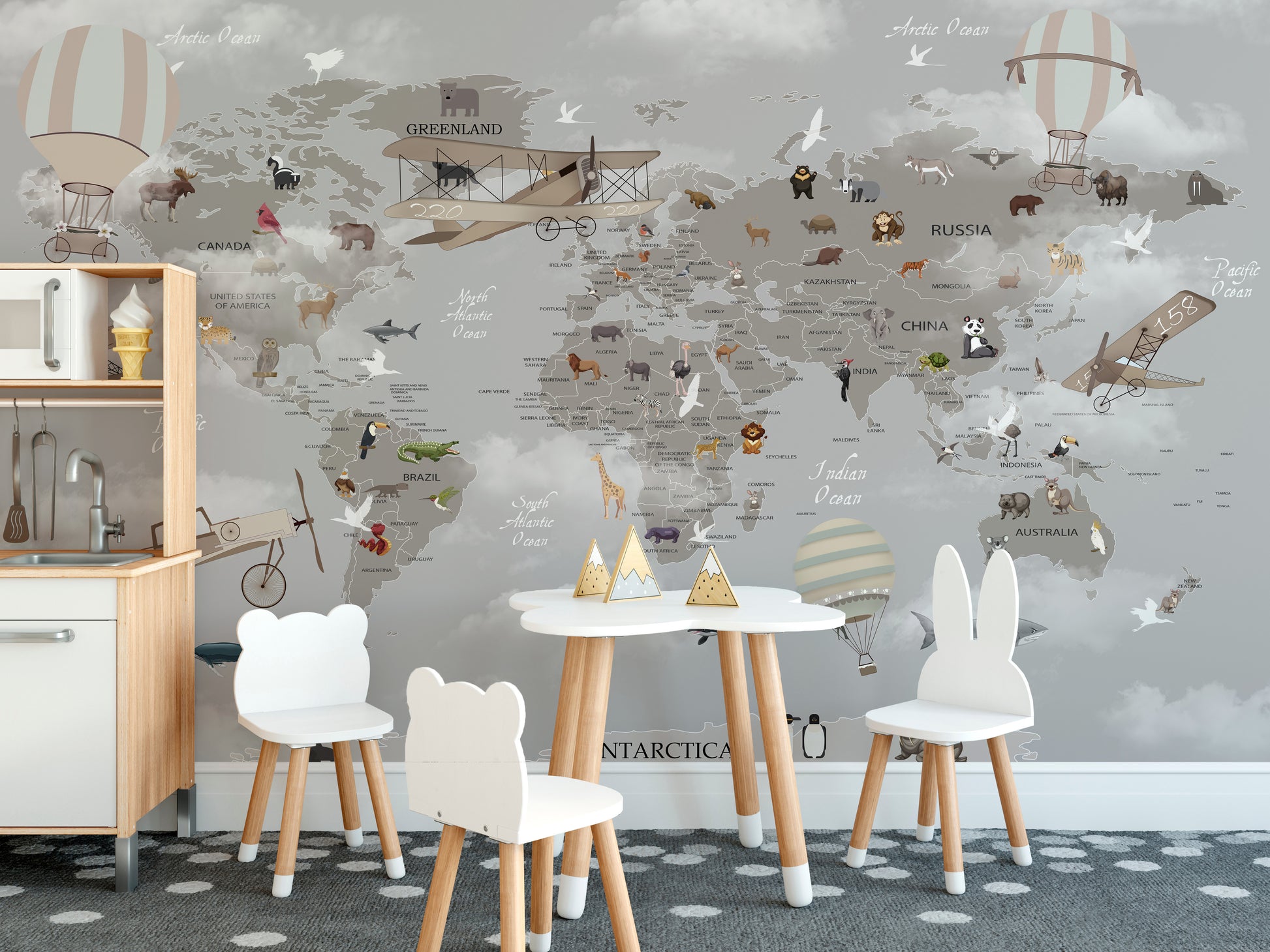 World map mural with animals aloft for imaginative kids' walls.



