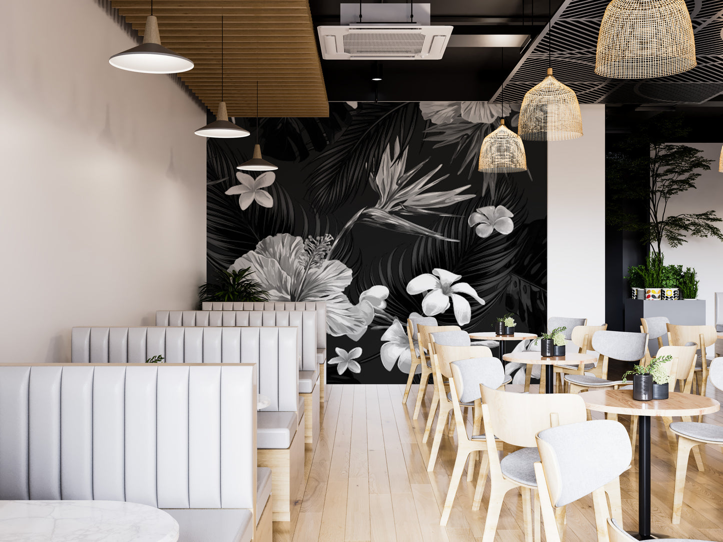 Artistic mural featuring black and white tropical floral designs.
