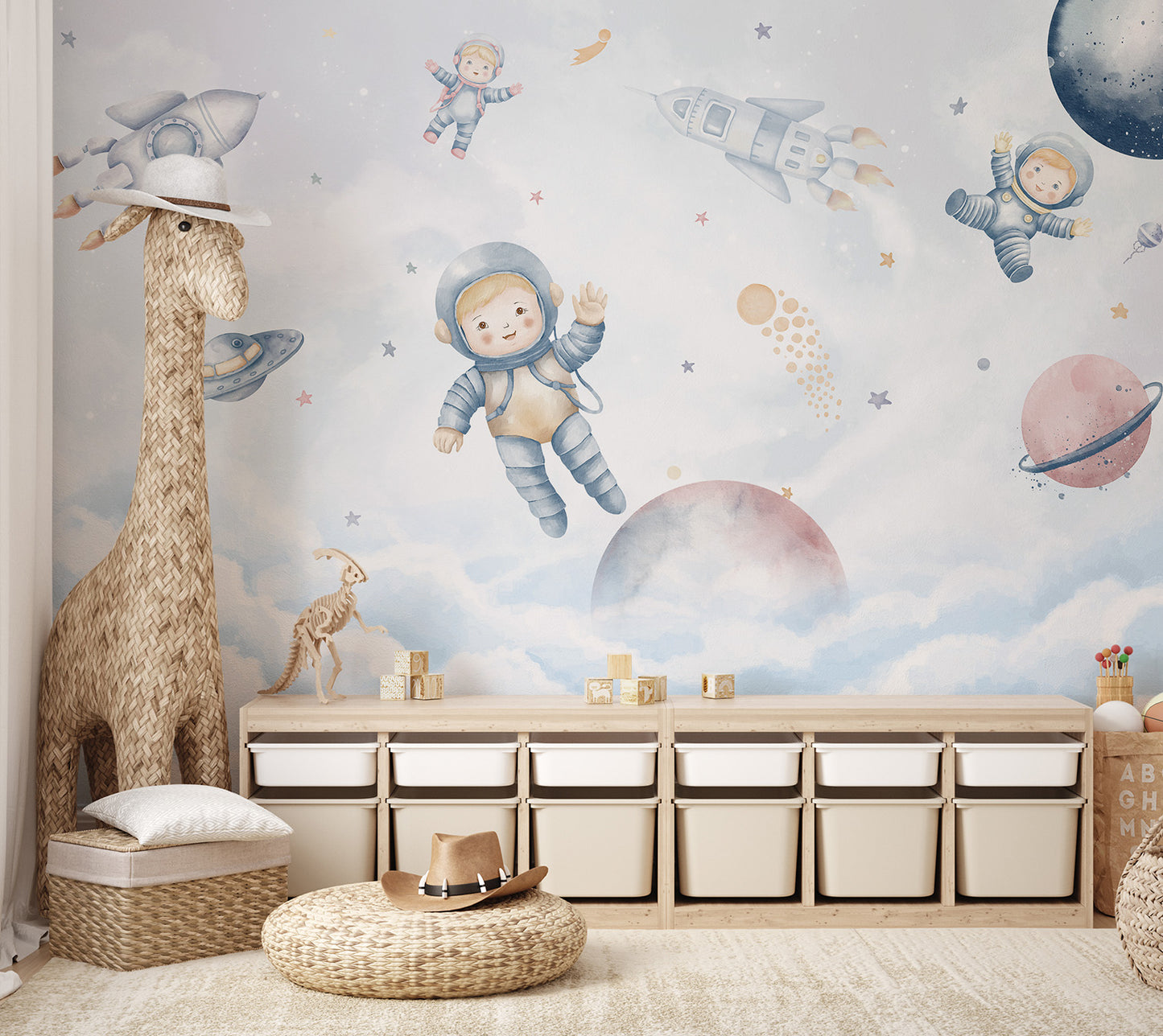 A playful space mural with little astronauts, rockets, and pastel-colored planets.