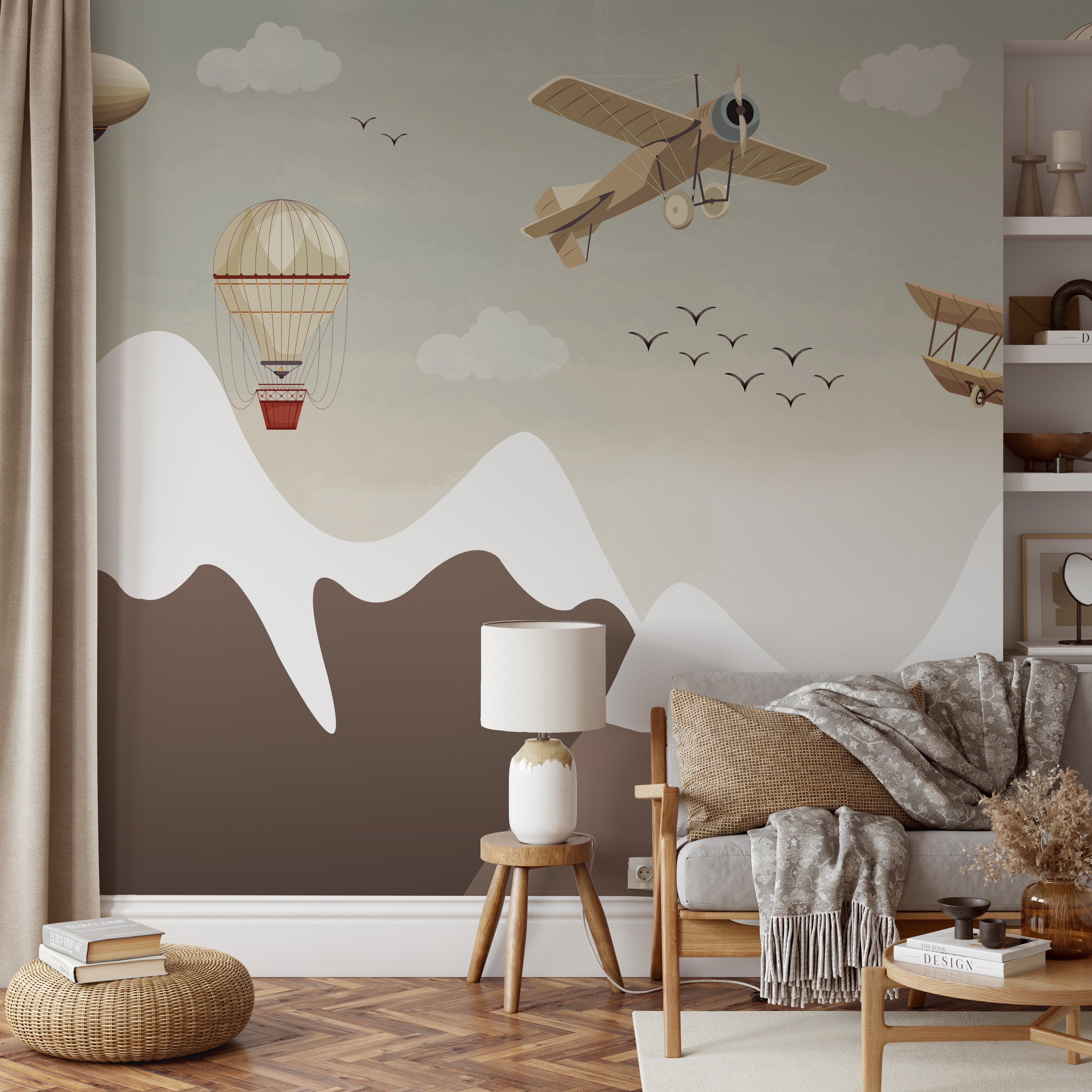 Retro planes and hot air balloons gliding through the sky above mountains.